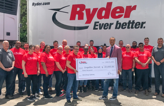 Ryder employees presenting check to Forgotten Harvest charity